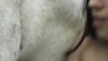Grinning chick demonstrates how a stallion's cock erupts with a huge cumshot