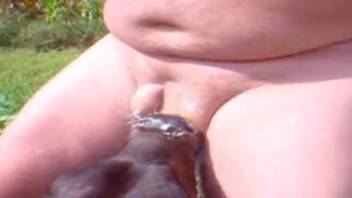 Bovine female deep-throating a guy's pulsating erection in the great outdoors