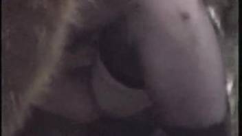 Animal-themed adult video featuring a petite female in bestiality acts