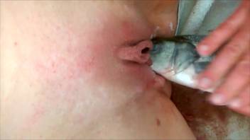 Lifeless fish penetrating a soaked vagina in a forbidden clip