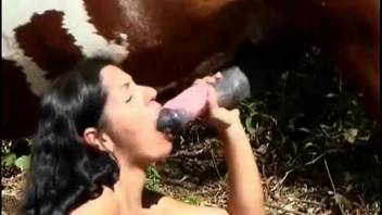 Tanned, curly-haired Latina giving head to a horse's dick