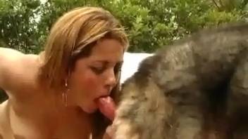 Sun-kissed babe gargling a pooch's fine dick live on webcam