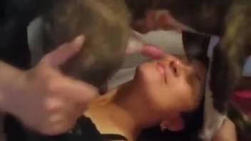Dark-haired woman being throat-fucked by a massive-cocked monster