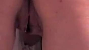 Close-up view of a nude female being penetrated and aroused