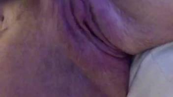 Nude woman offers intense close-up of attempting intercourse with a canine