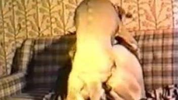 Retro video featuring a blonde MILF and her pet